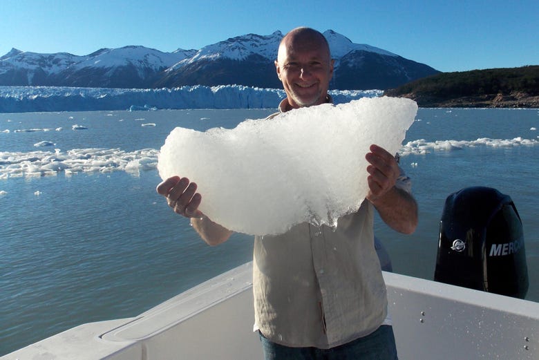 Taking a photo with a chunk of ice from Perito Moreno
