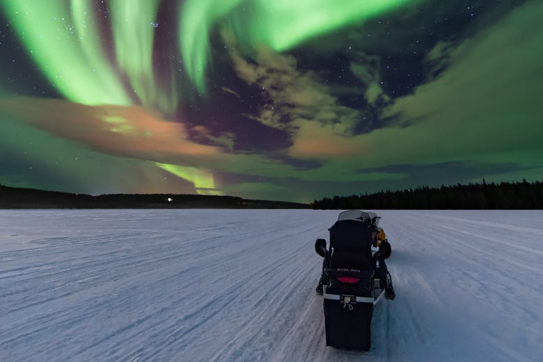 Snowmobile under the Northern Lights