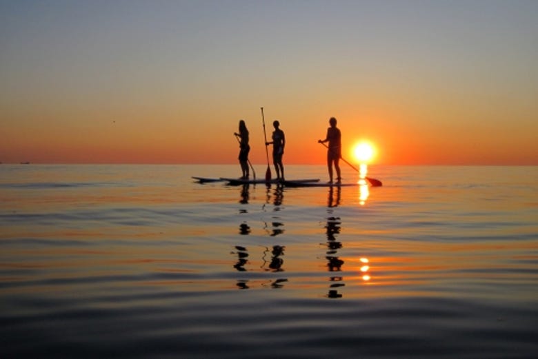 Paddle boarding in the light of the midnight sun