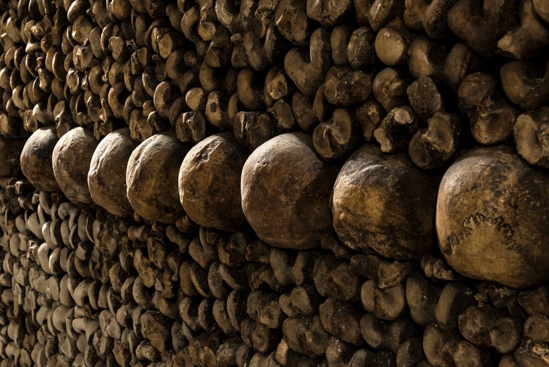 Bones piled up in the catacombs of Paris