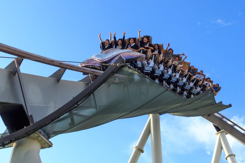 Enjoying one of the park's rollercoasters