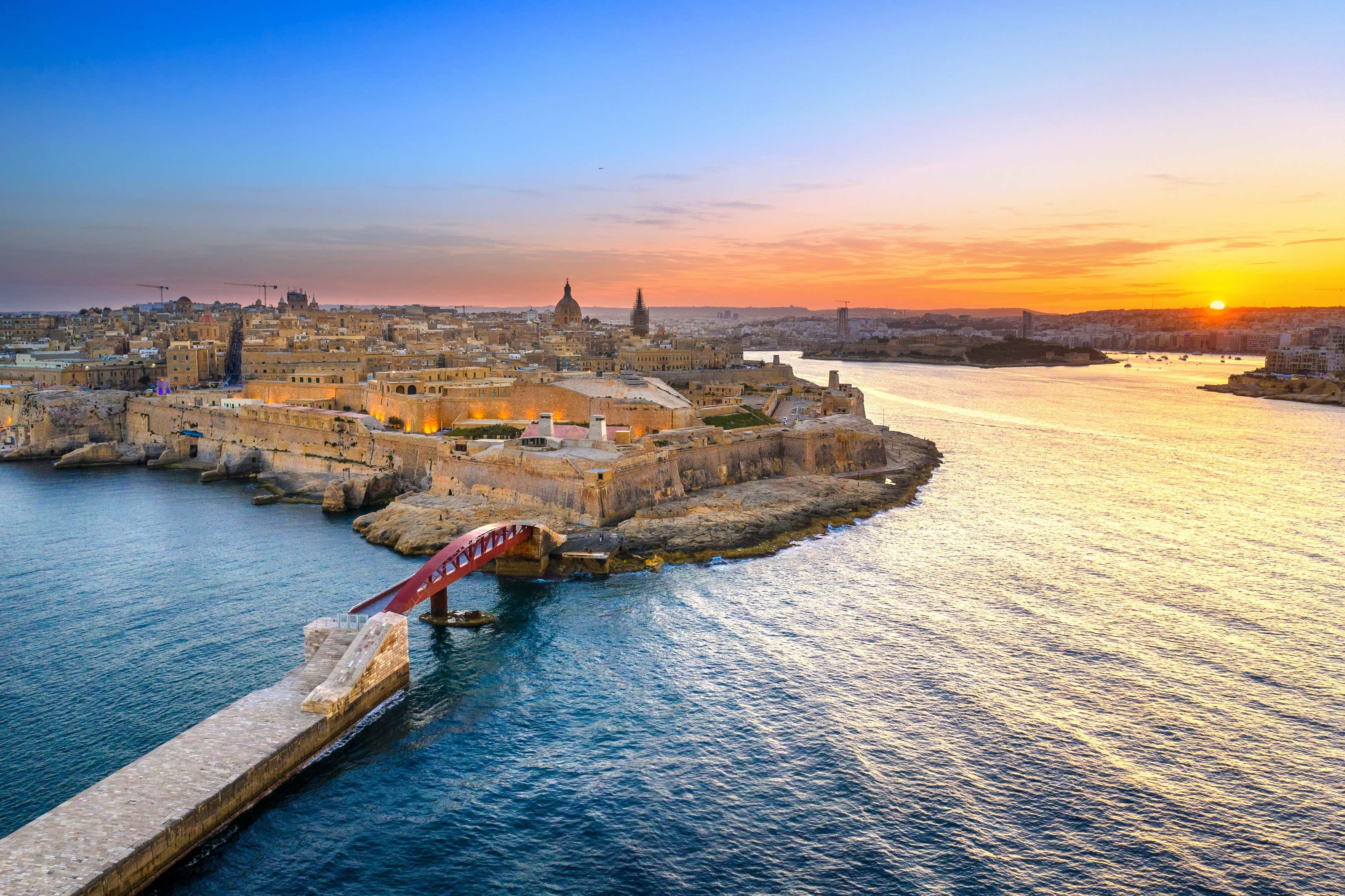 Valletta as seen from the air, with a red bridge in the foreground.