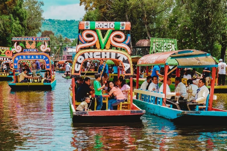 Sailing in trajineras through the canals of Xochimilco