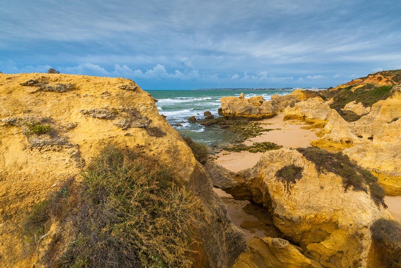 Rocks and golden beach of Praia da Galé